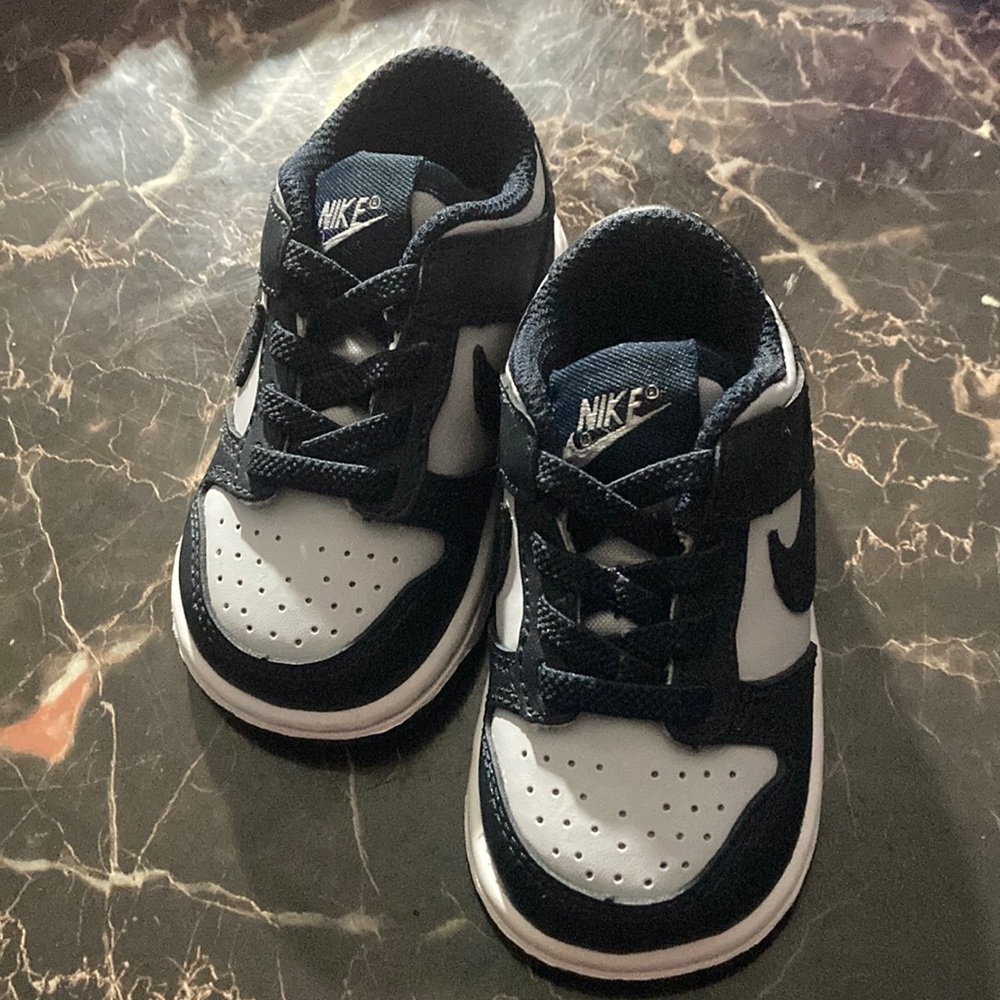 I am selling the Nike dunk George Towns and they are black gray and white